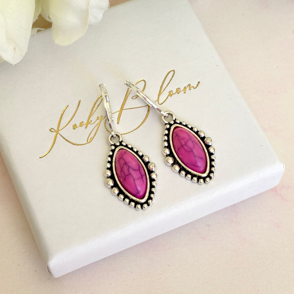 Silver Pink stone horse eye huggie earrings.