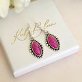 Silver Pink stone horse eye huggie earrings.