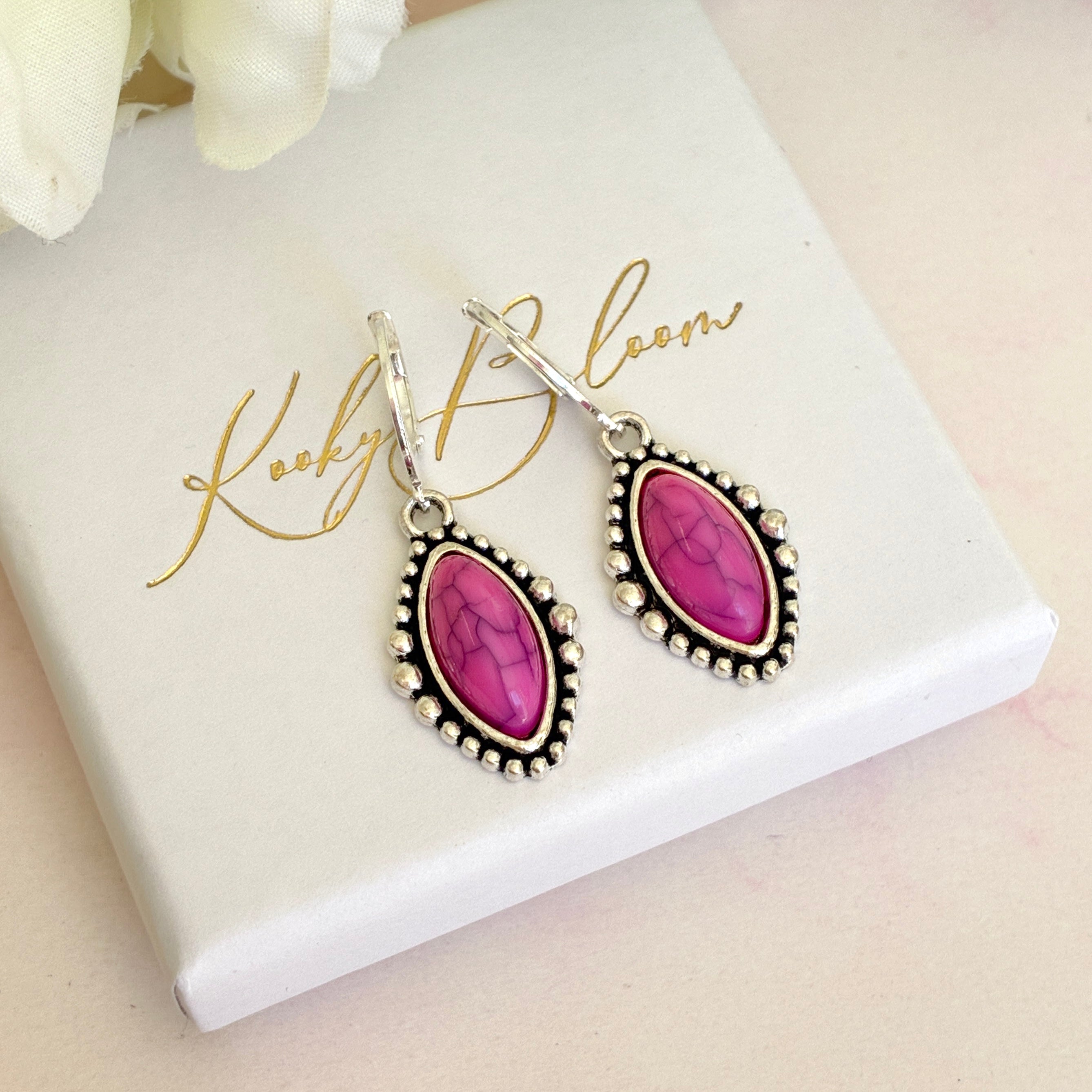 Silver Pink stone horse eye huggie earrings.
