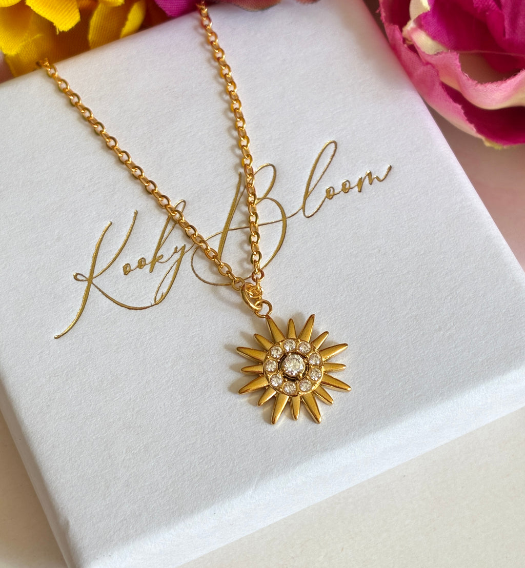 Gold CZ Star Sun ray Necklace.