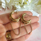 Gold chunky chain loop stud hoop earrings.