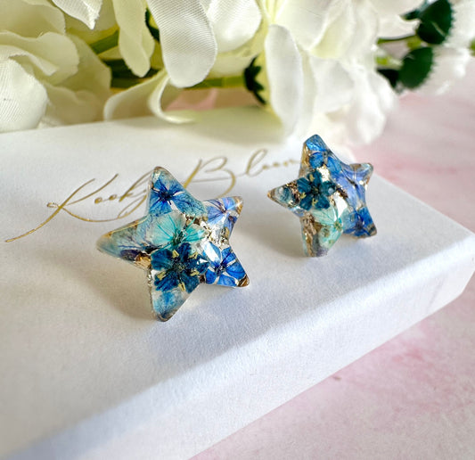 Blue Bloom Star 925 sterling stud earrings.