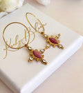 Gold Pink crystal cross hoop earrings.