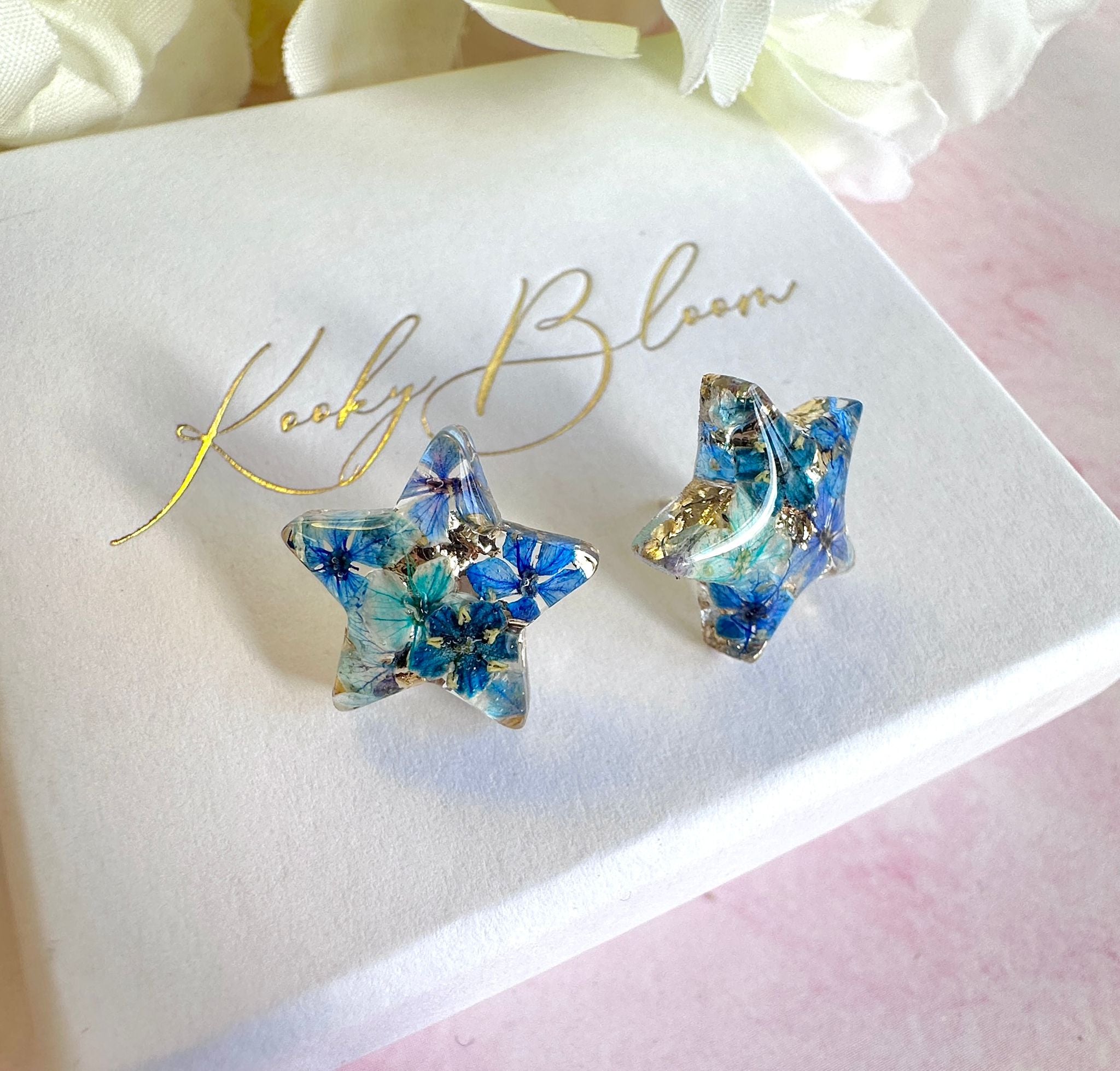 Blue Bloom Star 925 sterling stud earrings.