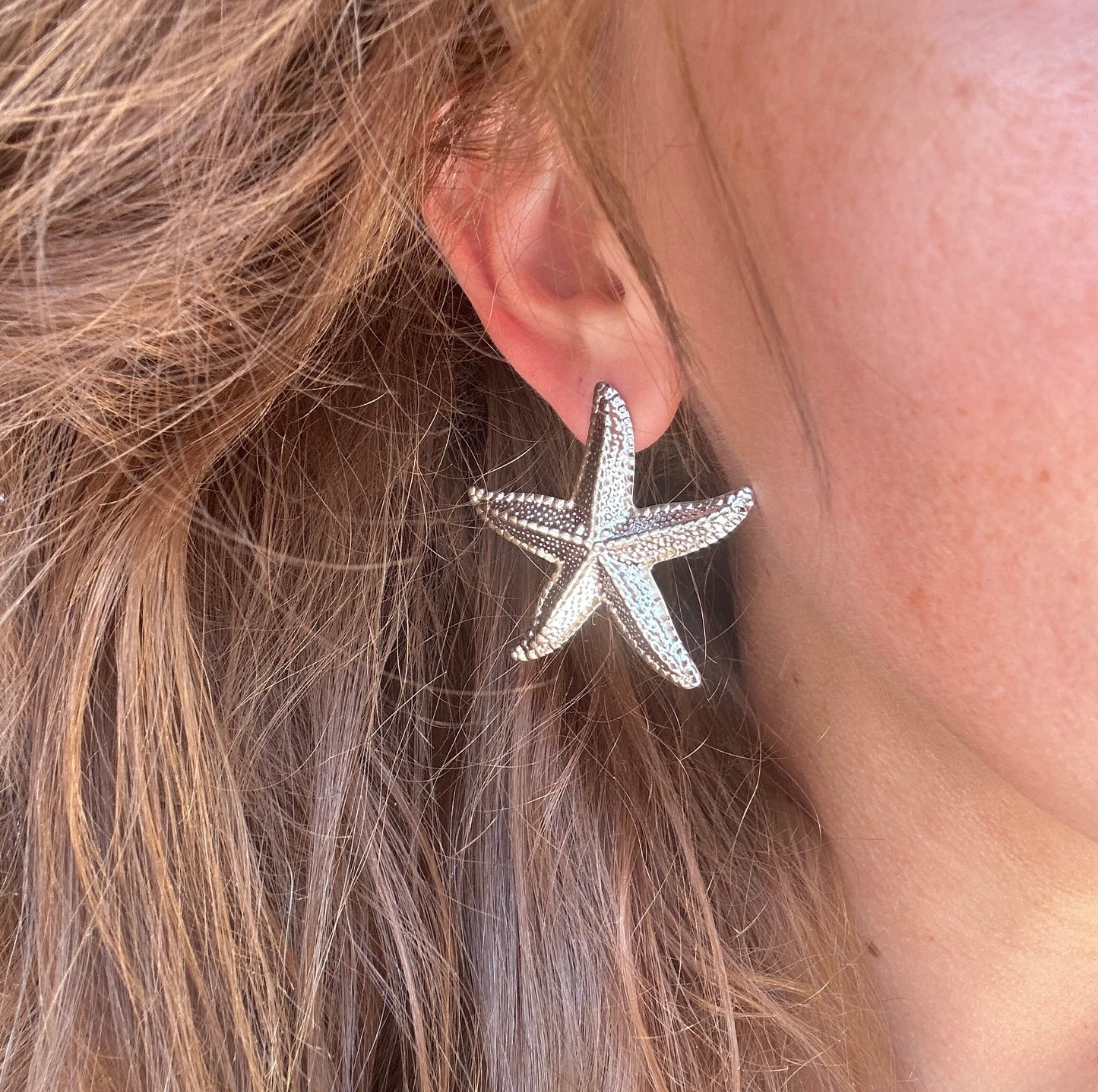 Silver Oversized Starfish stud earrings.
