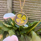 Gold lucky four leaf clover necklace.
