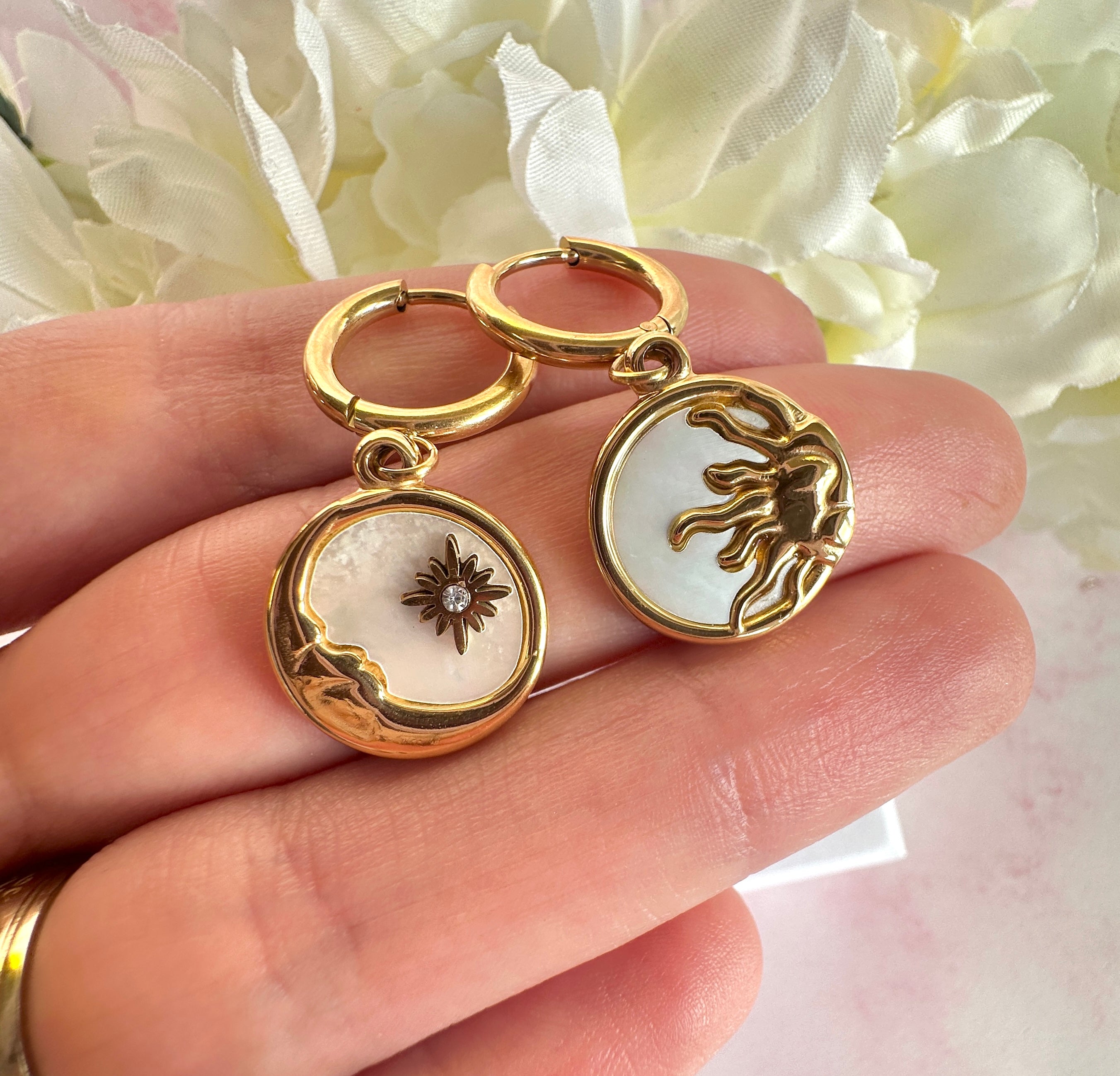 Gold Sun & Moon shell Huggie hoop earrings.