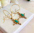 Gold Turquoise crystal cross hoop earrings.