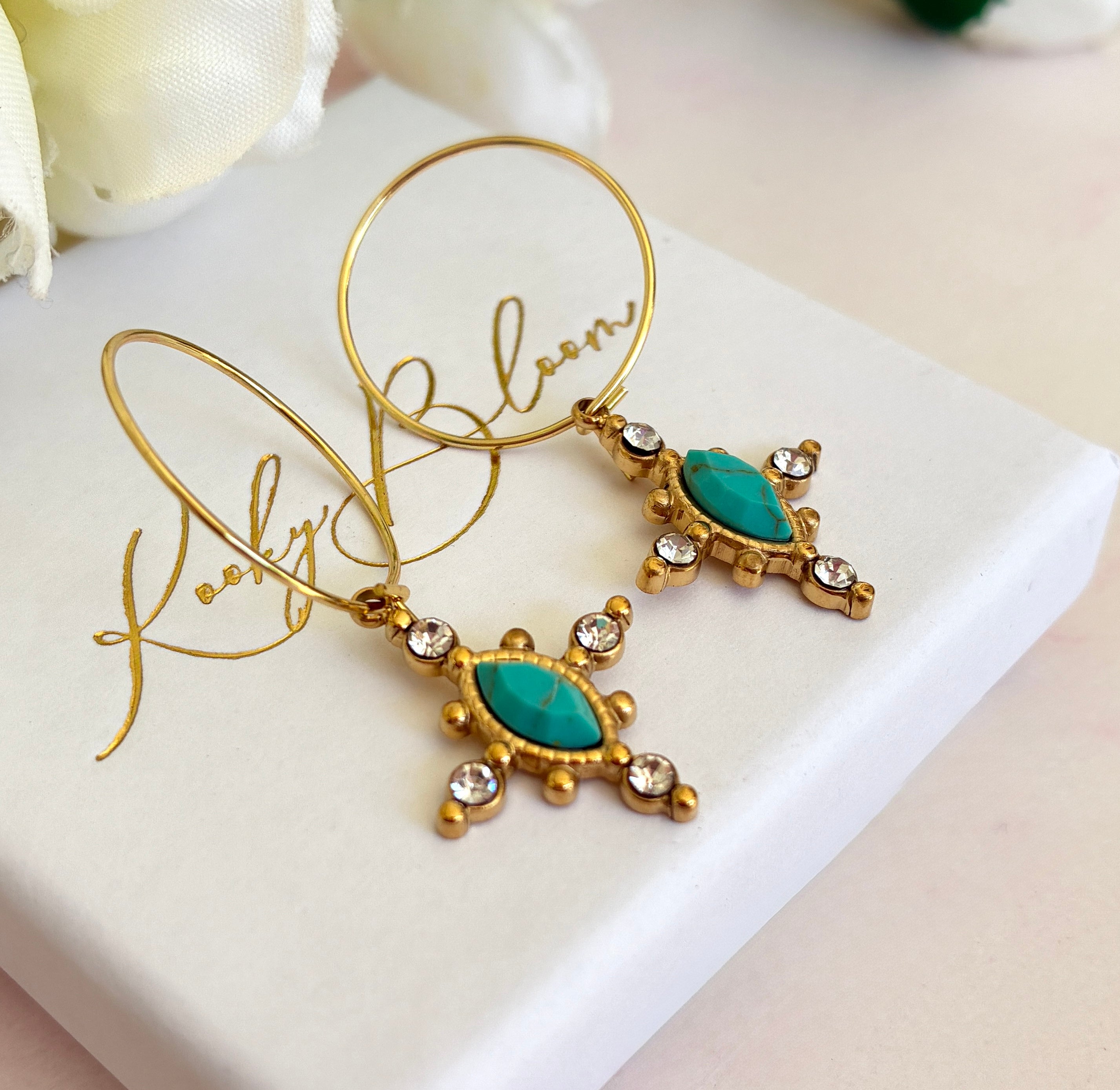 Gold Turquoise crystal cross hoop earrings.