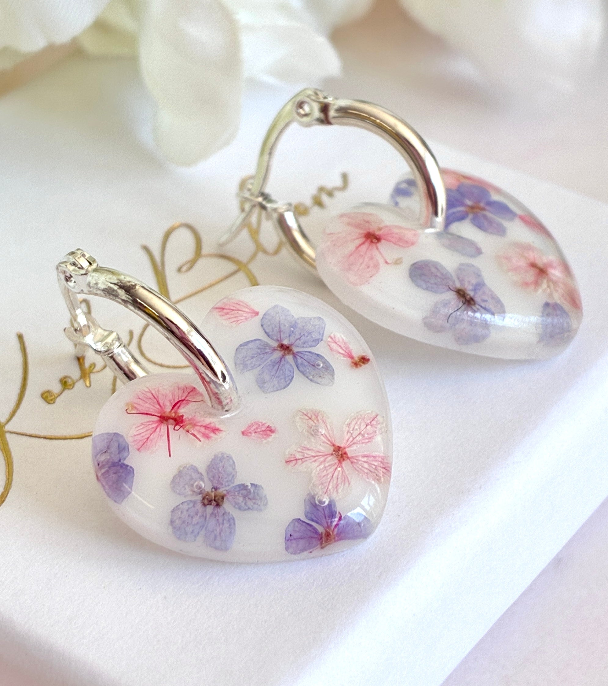 Marshmallow bloom heart earrings.