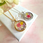 Silver Real flower capsule locket necklace.