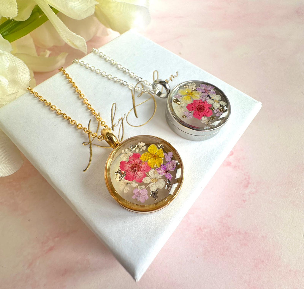 Silver Real flower capsule locket necklace.