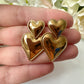 Gold large Double heart drop earrings.