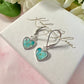 925 sterling silver Aqua Petal heart huggie earrings.