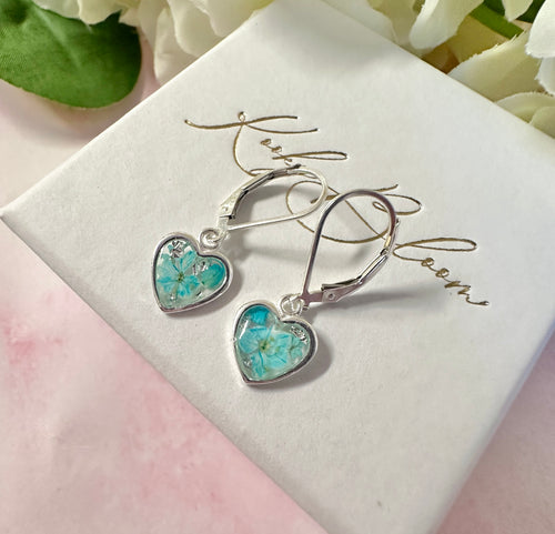 925 sterling silver Aqua Petal heart huggie earrings.