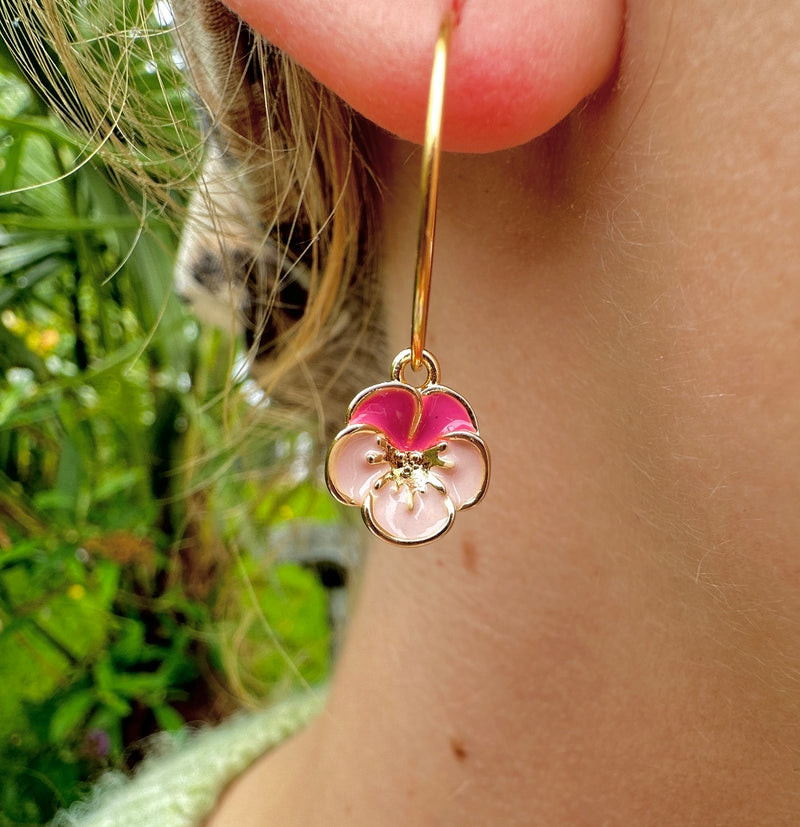 Pink Voila flower gold hoop earrings.