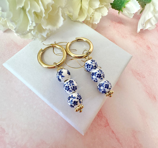 Gold Blue White floral drop bead earrings.
