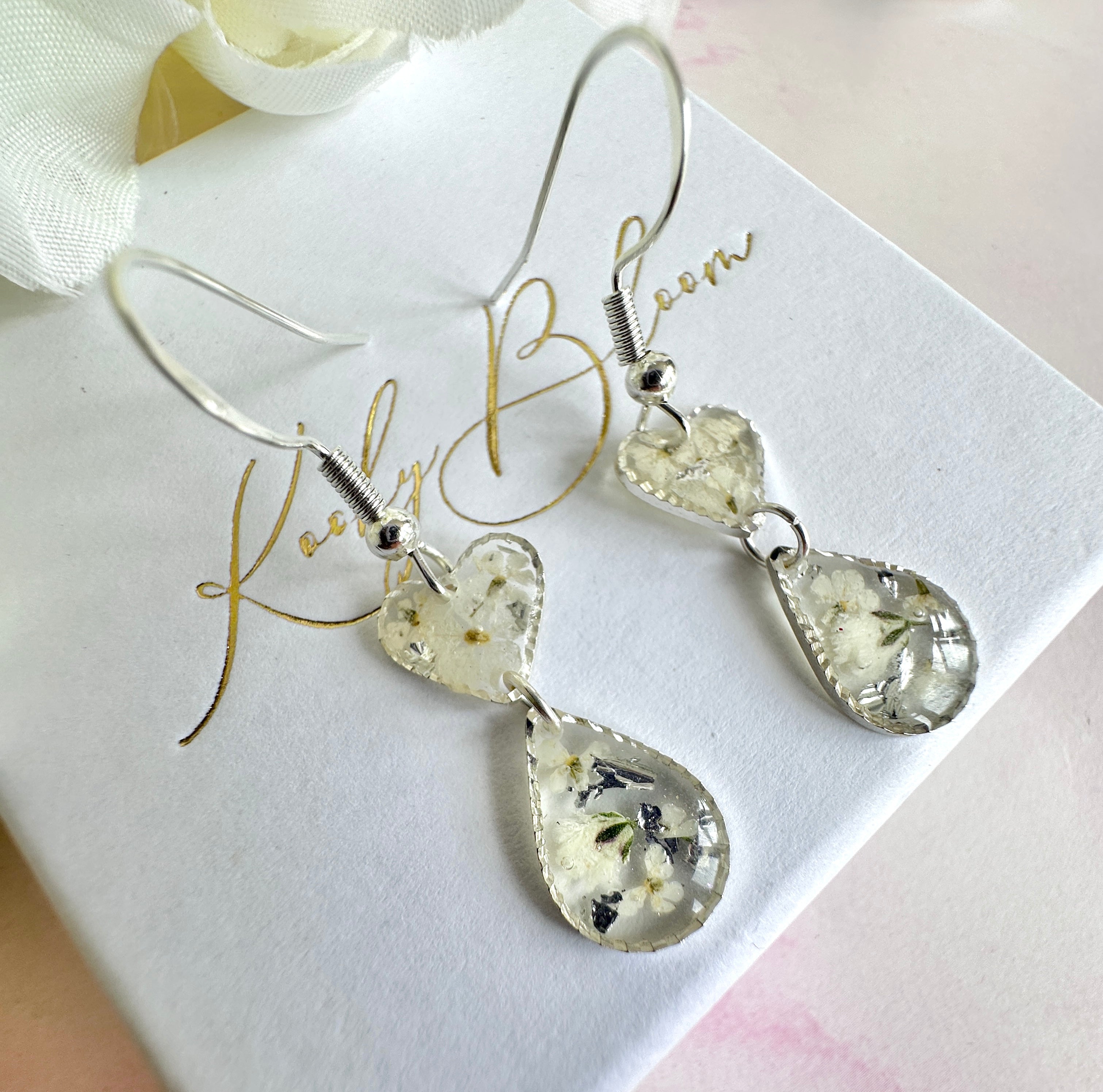 Tiny white flower Heart drop hook earrings.
