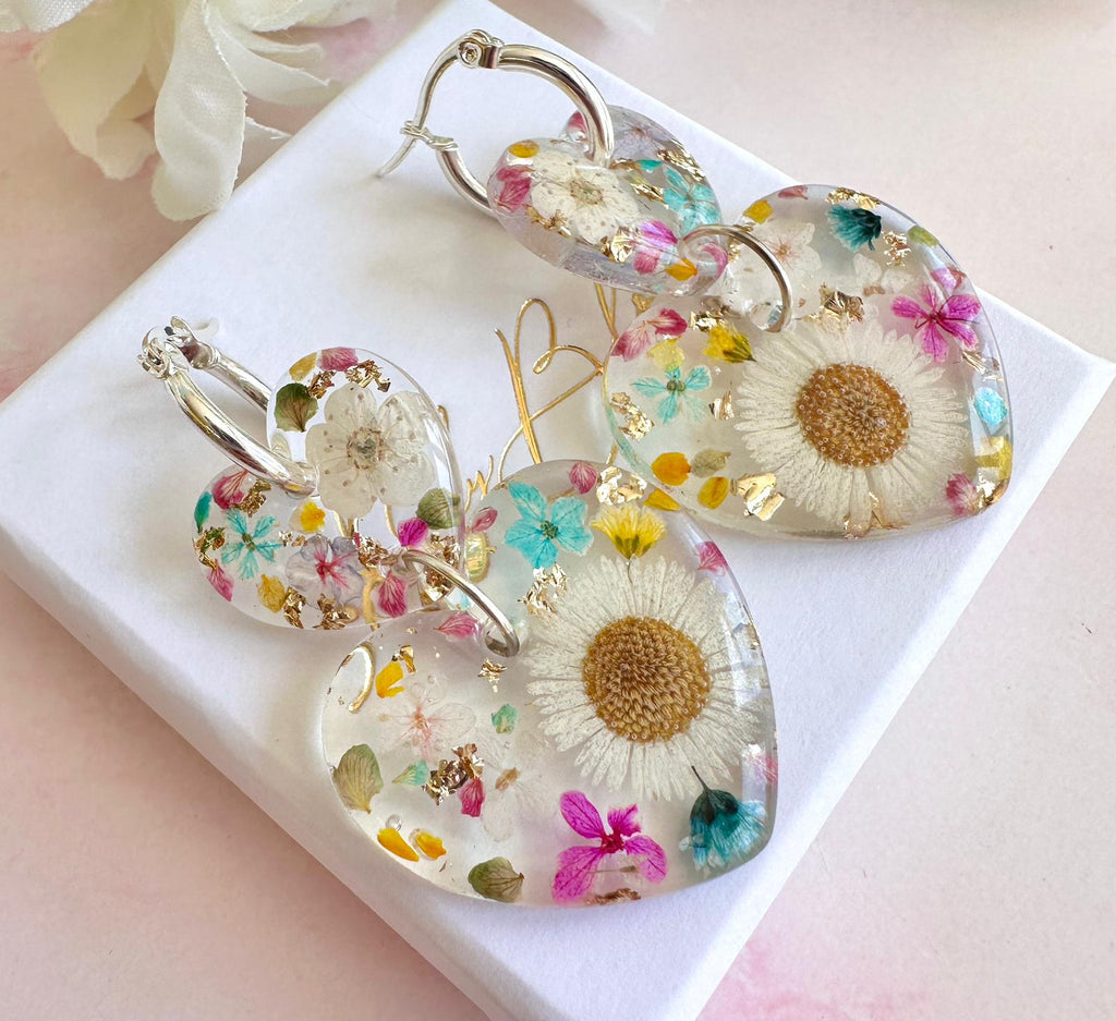 Daisy confetti double heart drop hoop earrings.