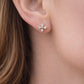Gold CZ flower stud earrings.