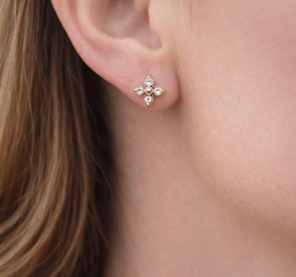 Gold CZ flower stud earrings.