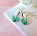 Silver Tiny Turquoise bloom heart Huggies earrings.