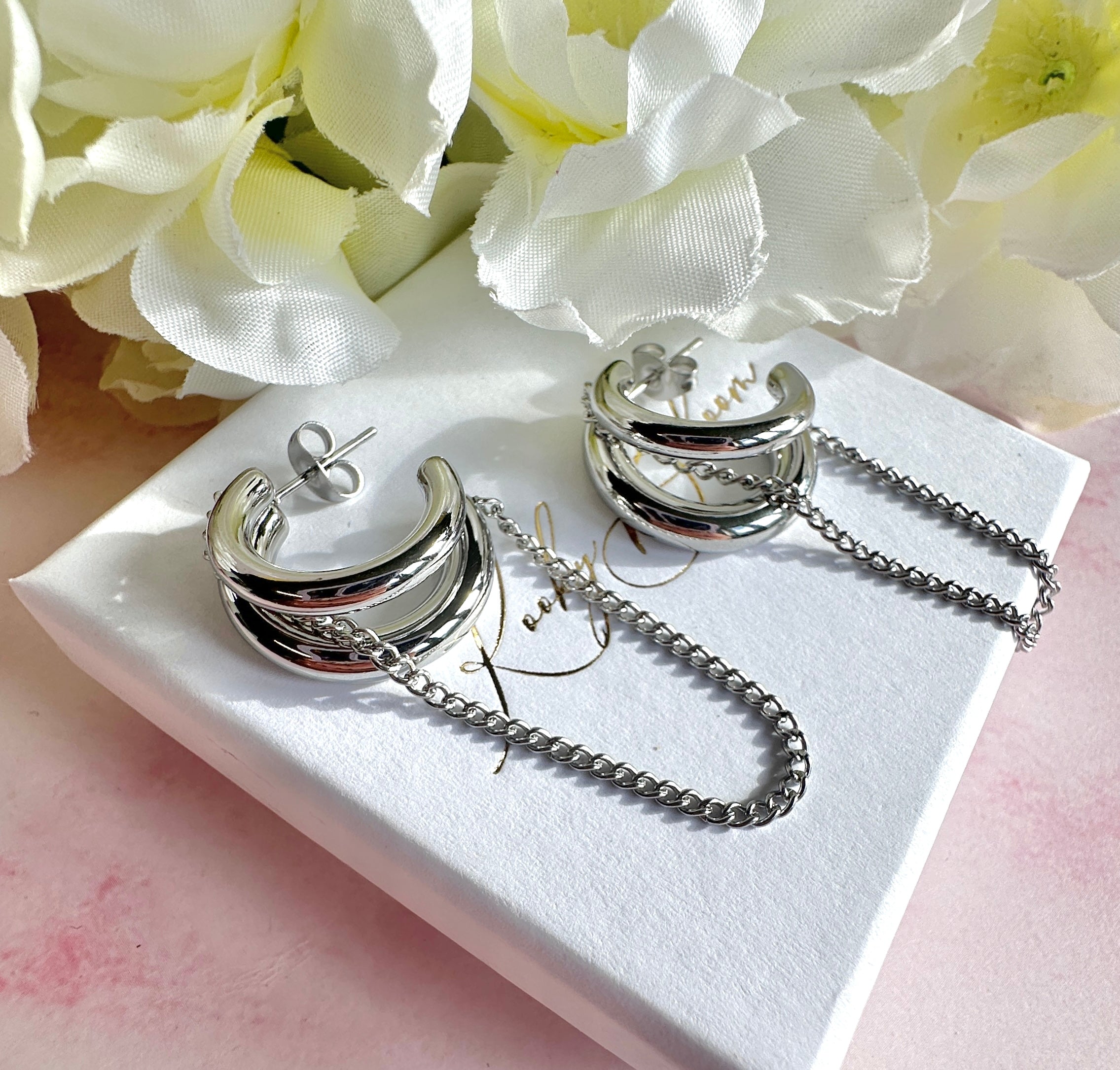 Silver chunky chain loop stud hoop earrings.