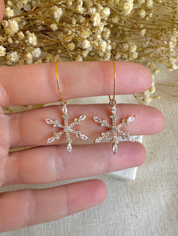 Gold Sparkle Snowflake Hoop earrings.
