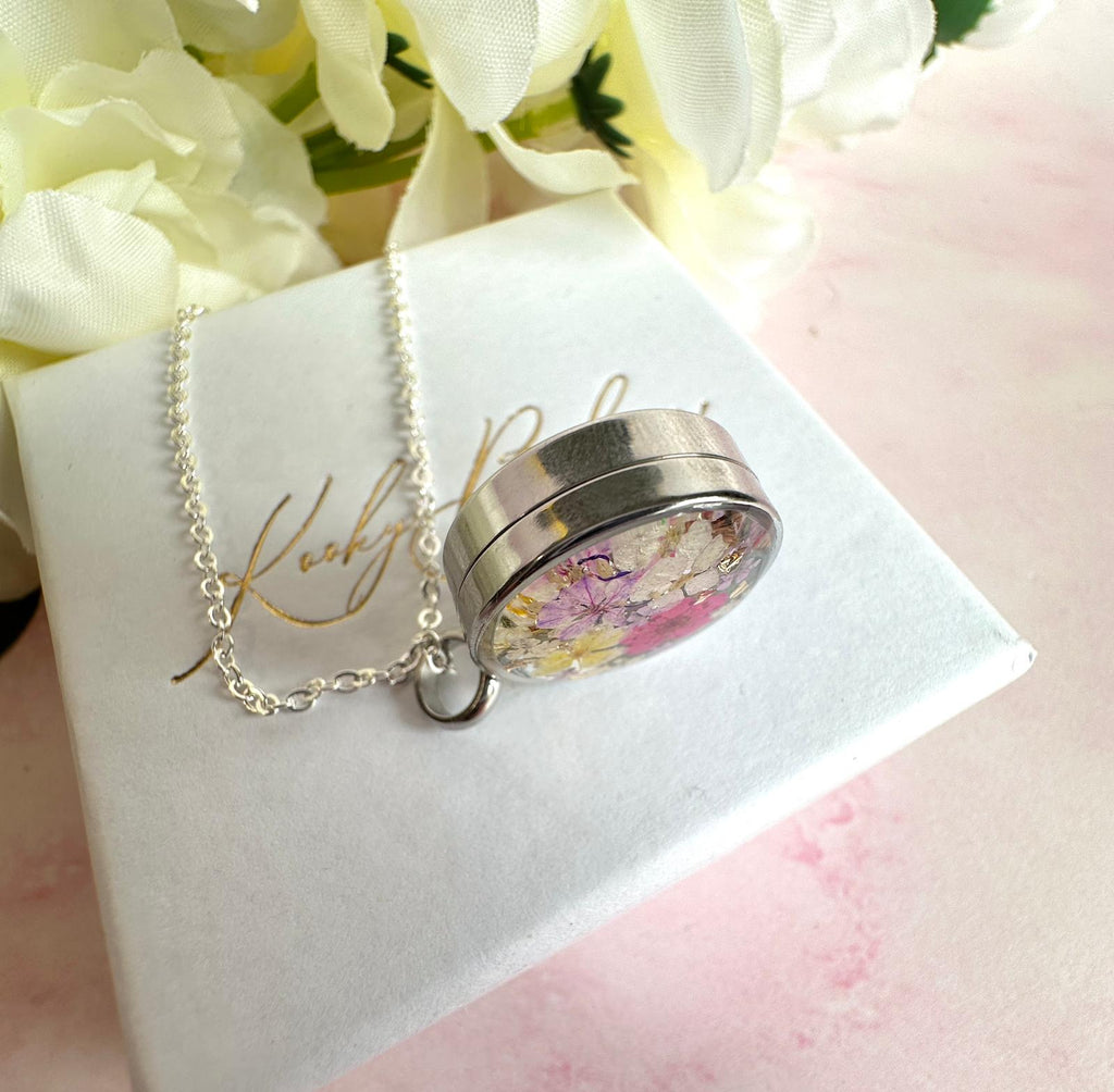 Silver Real flower capsule locket necklace.