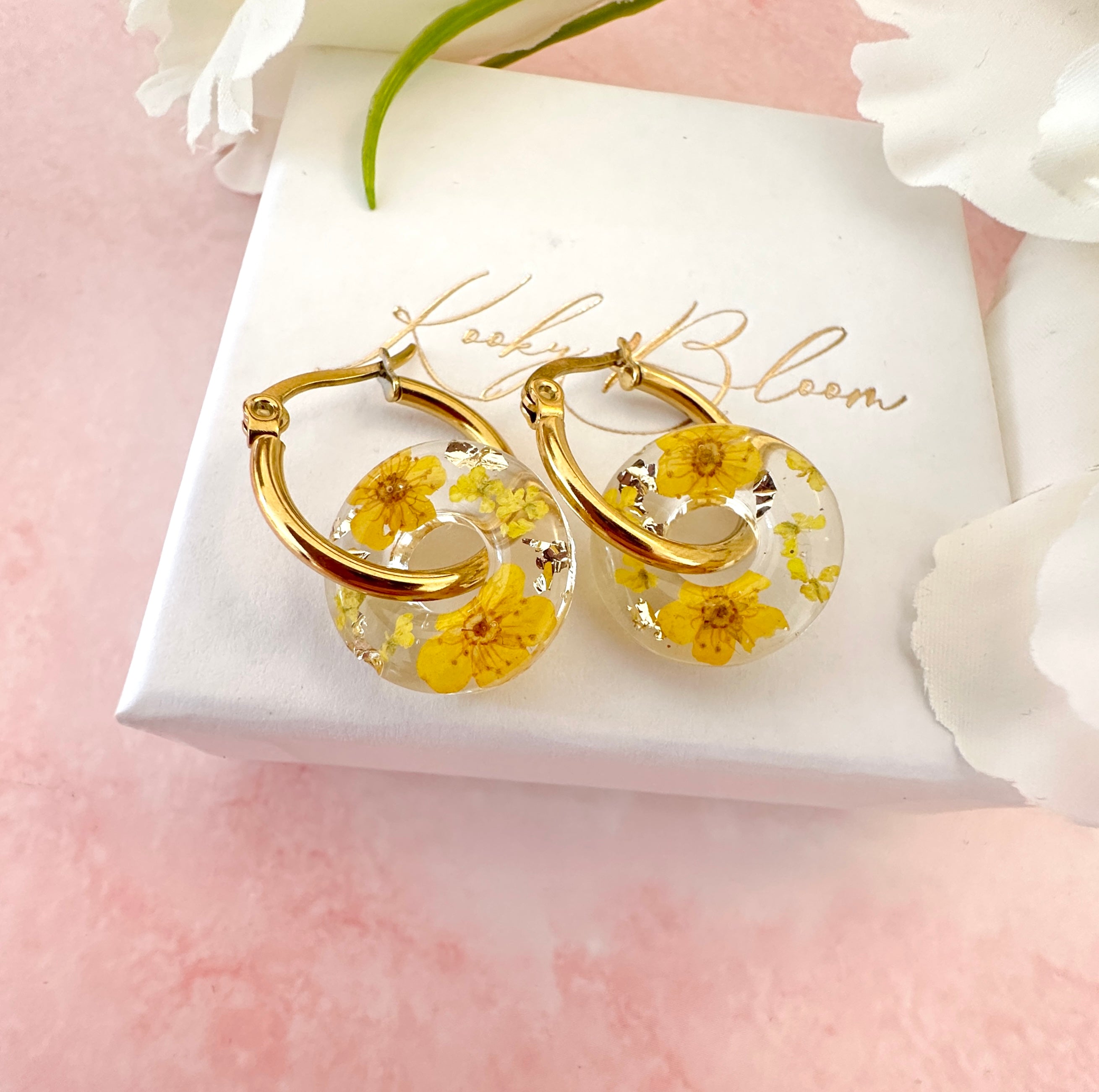 Yellow blossom bloom flower donut earrings.