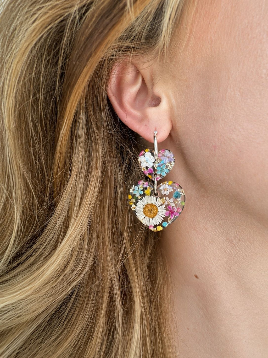 Daisy confetti double heart drop hoop earrings.