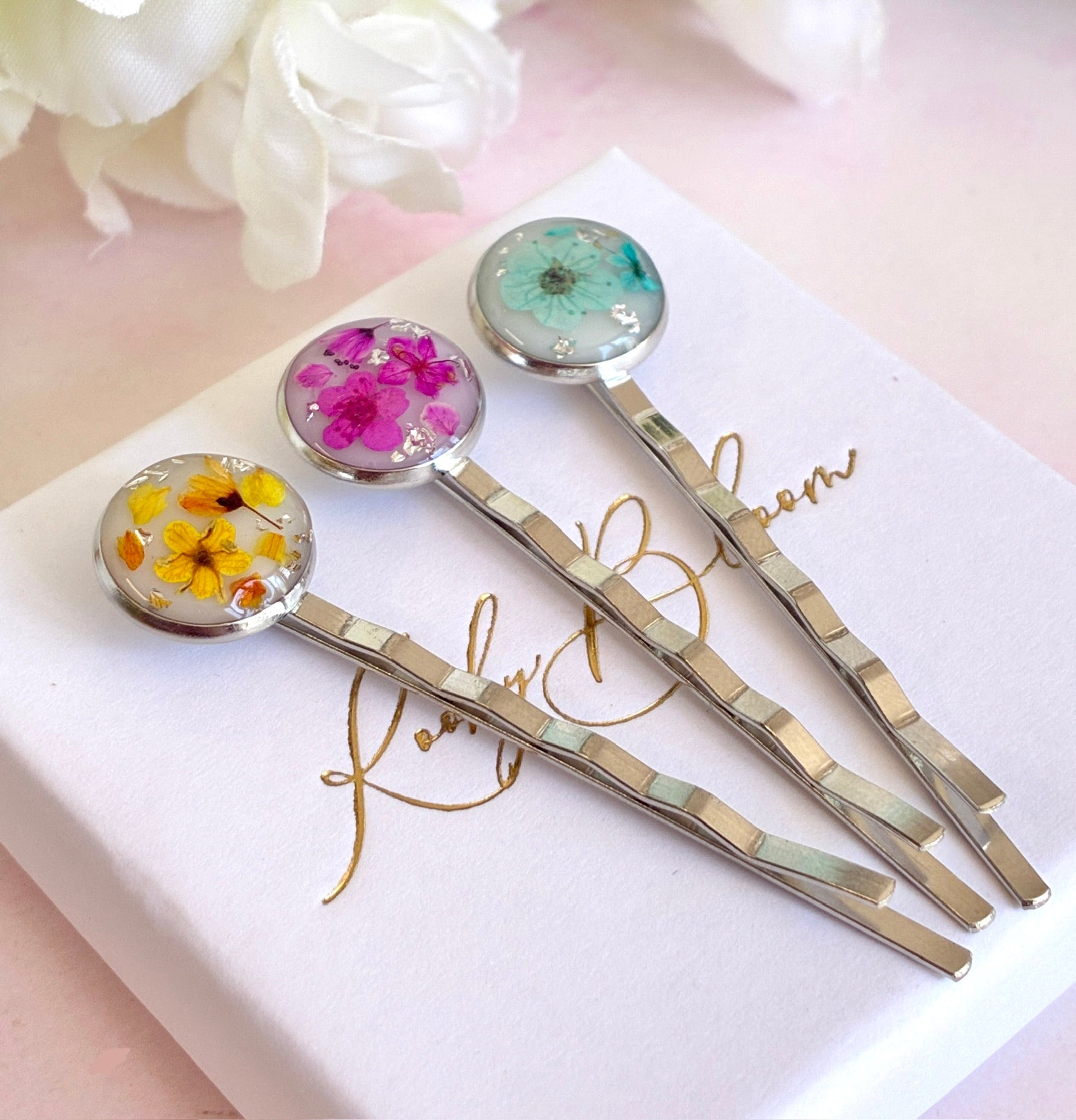Silver set of 3 Bloom flower hair slides.