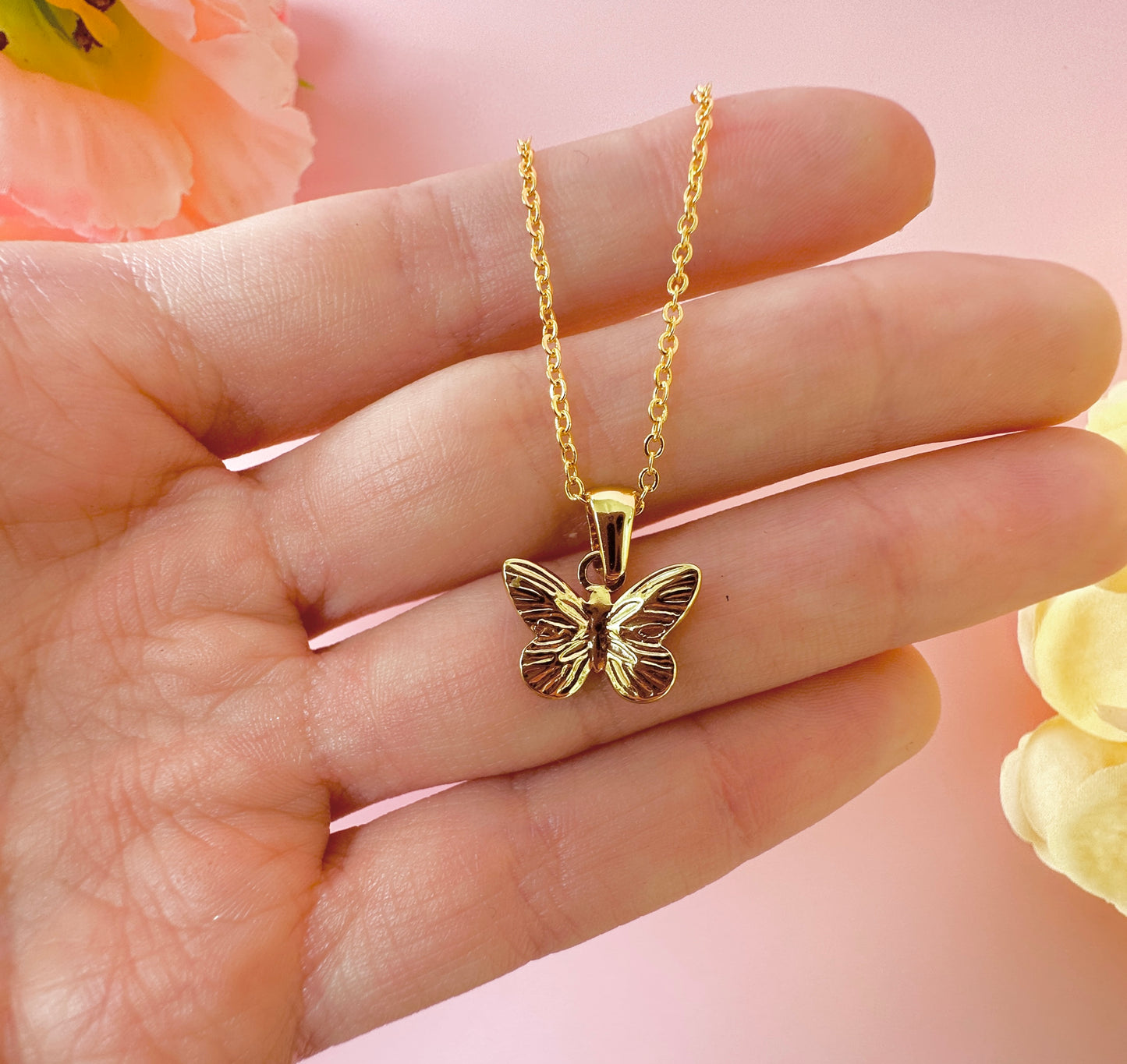 Gold mini Butterfly necklace.