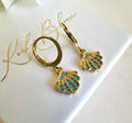 Gold Tiny Blue stone seashell huggie earrings.