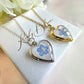 Silver Forget me not flower heart locket necklace.