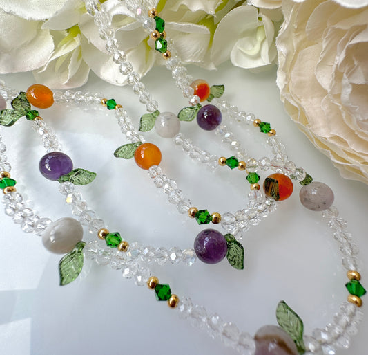 Glass beaded gemstone fruit necklace.