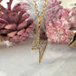 Gold CZ Lightning Bolt necklace.