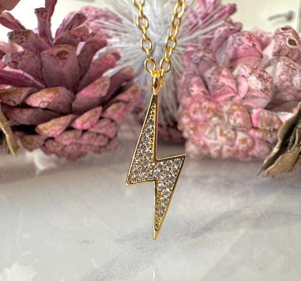 Gold CZ Lightning Bolt necklace.