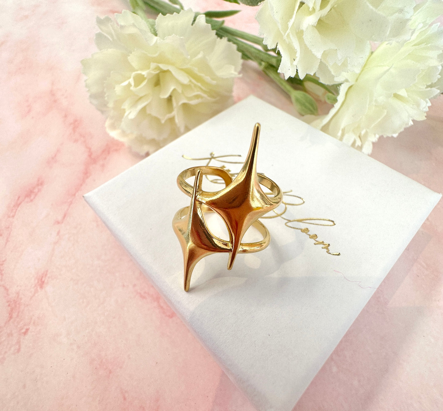 Gold statement double star adjustable ring.