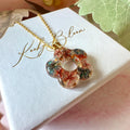 Gold Ember Bloom flower necklace.