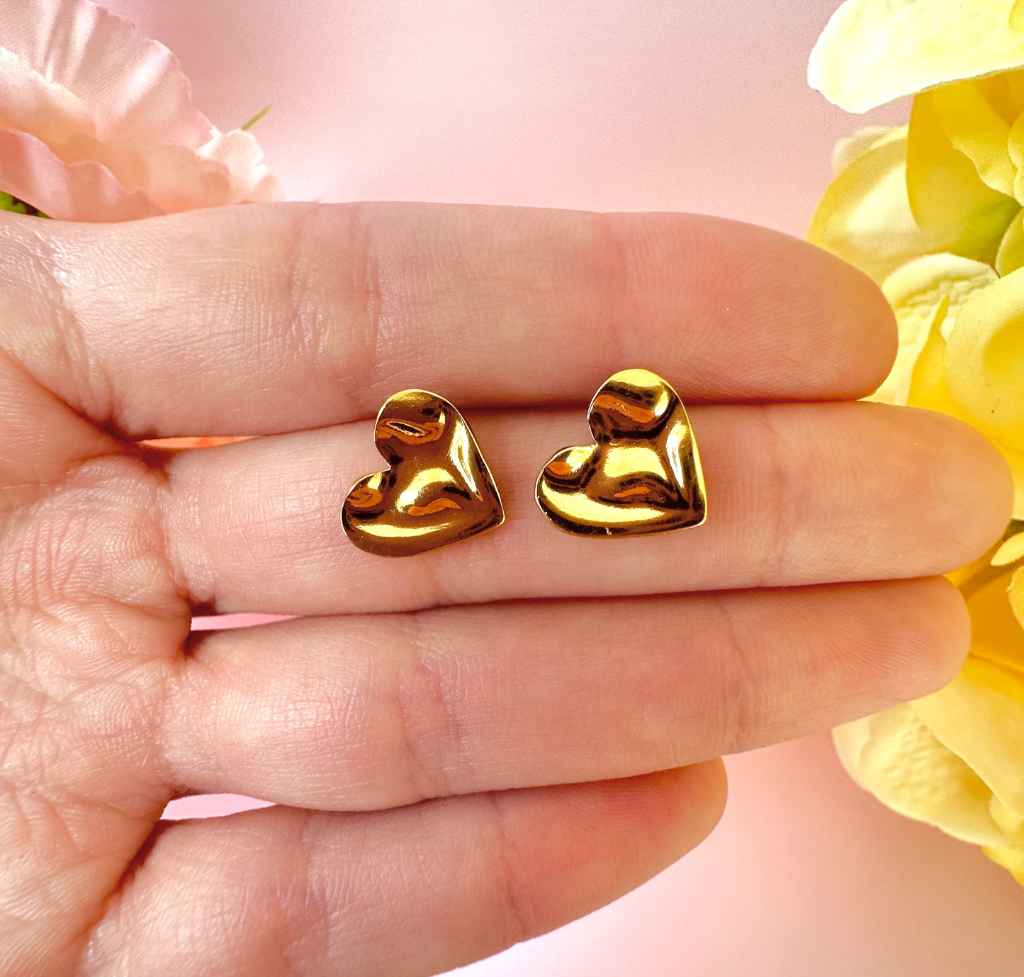 Gold Wobbly Heart stud earrings.