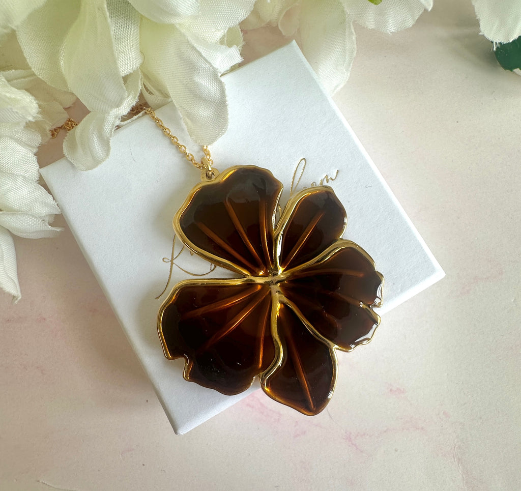 Gold brown oversized flower necklace.