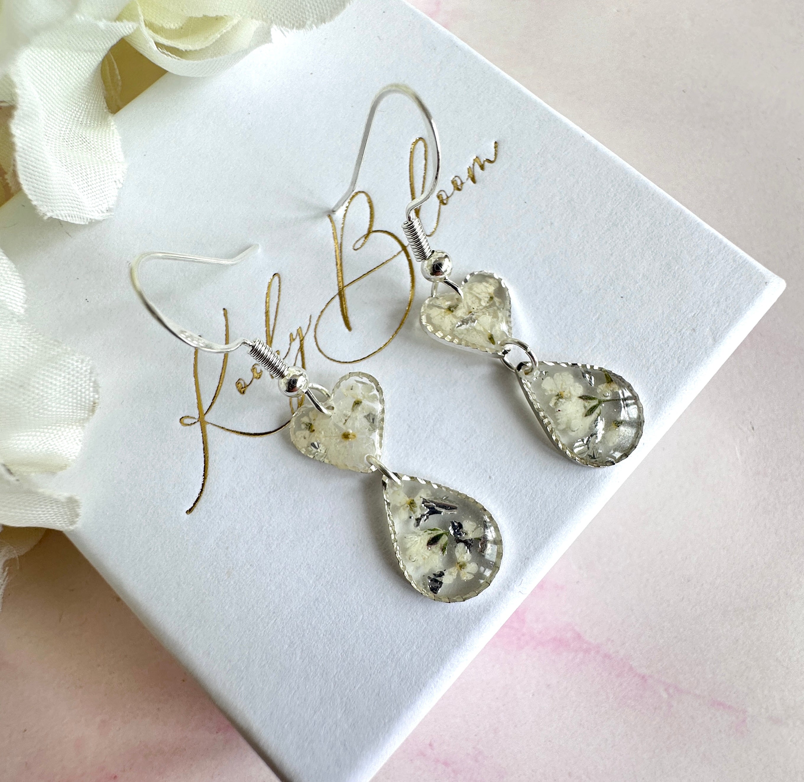 Tiny white flower Heart drop hook earrings.