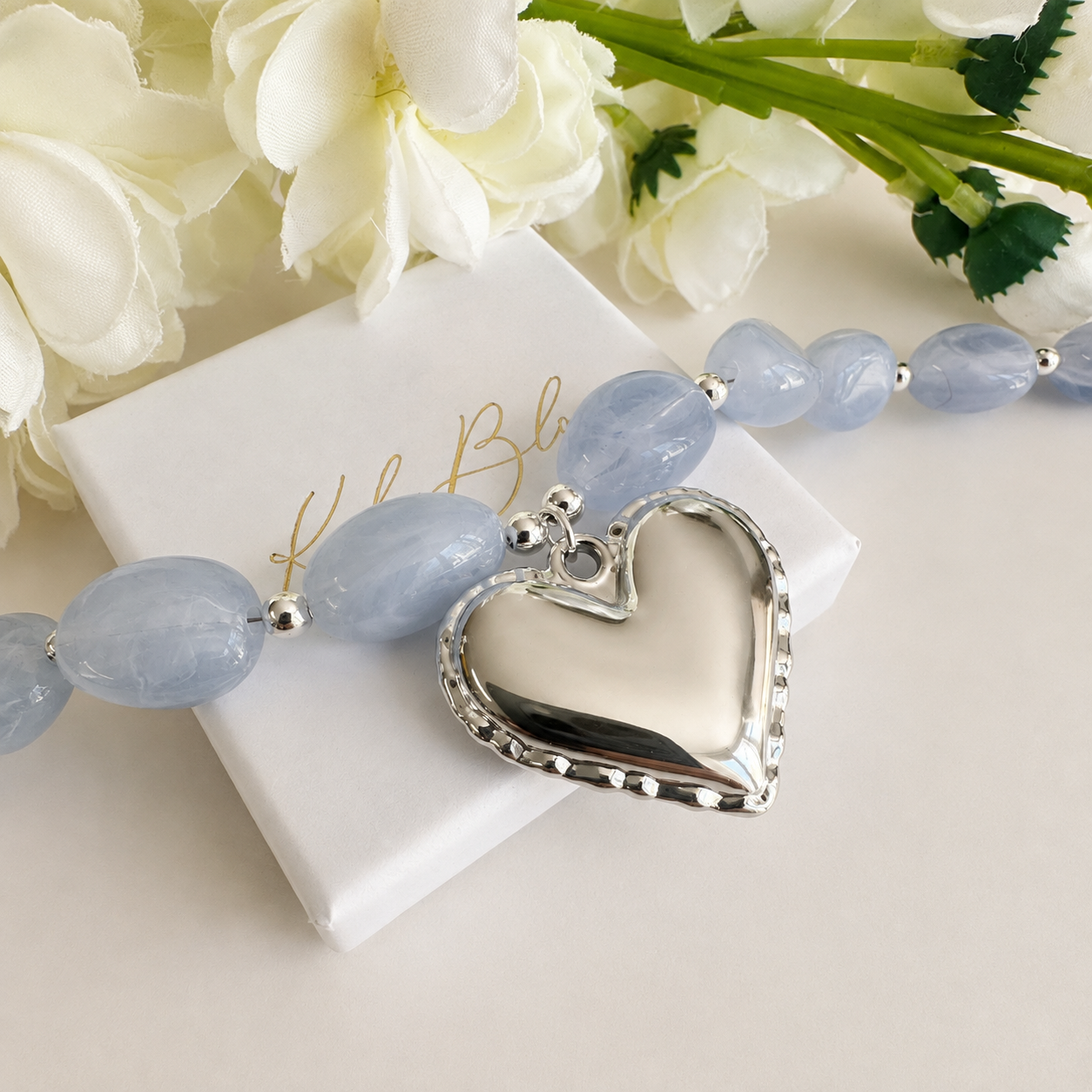 Silver chunky pale blue stone Heart necklace.
