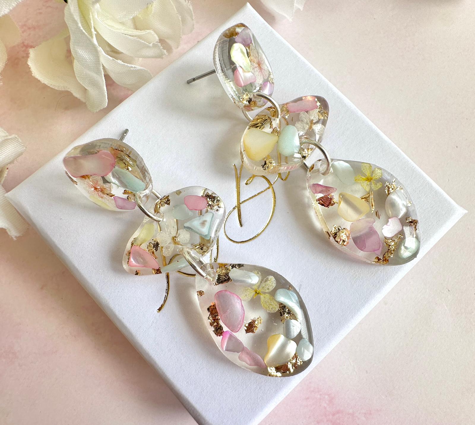 Pastel Seashell & Bloom pebble drop stud earrings.