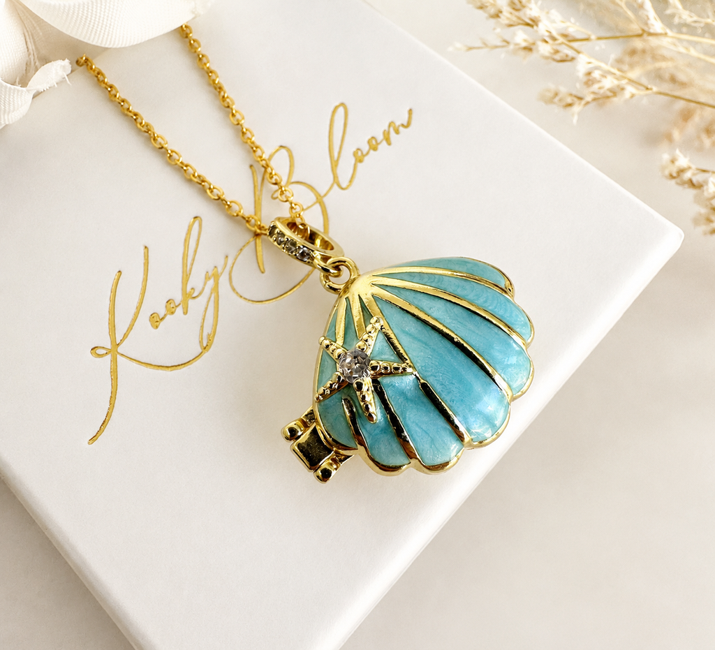Gold Blue enamel Seashell locket necklace.