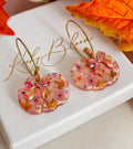 Rosie Bloom Bow Pumpkin hoop earrings.