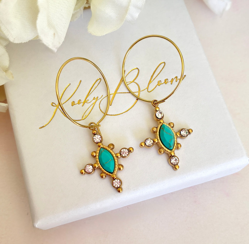 Gold Turquoise crystal cross hoop earrings.