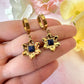 Gold Blue stone Flower Huggie earrings.
