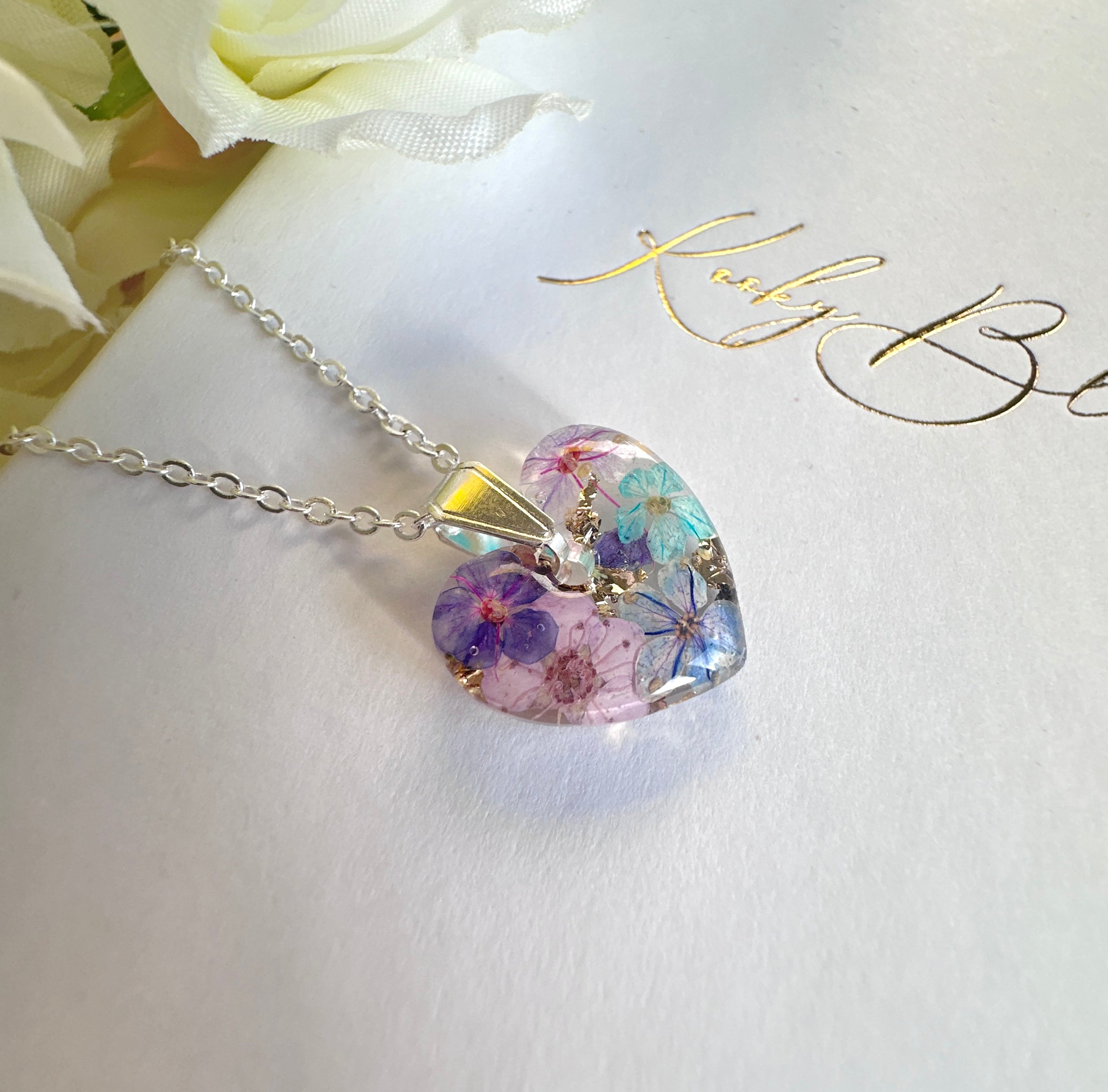 Silver Mini Violet meadow heart necklace.